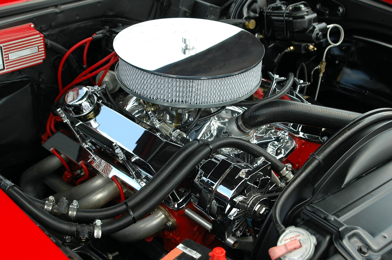 Chrome engine detail with red bodywork